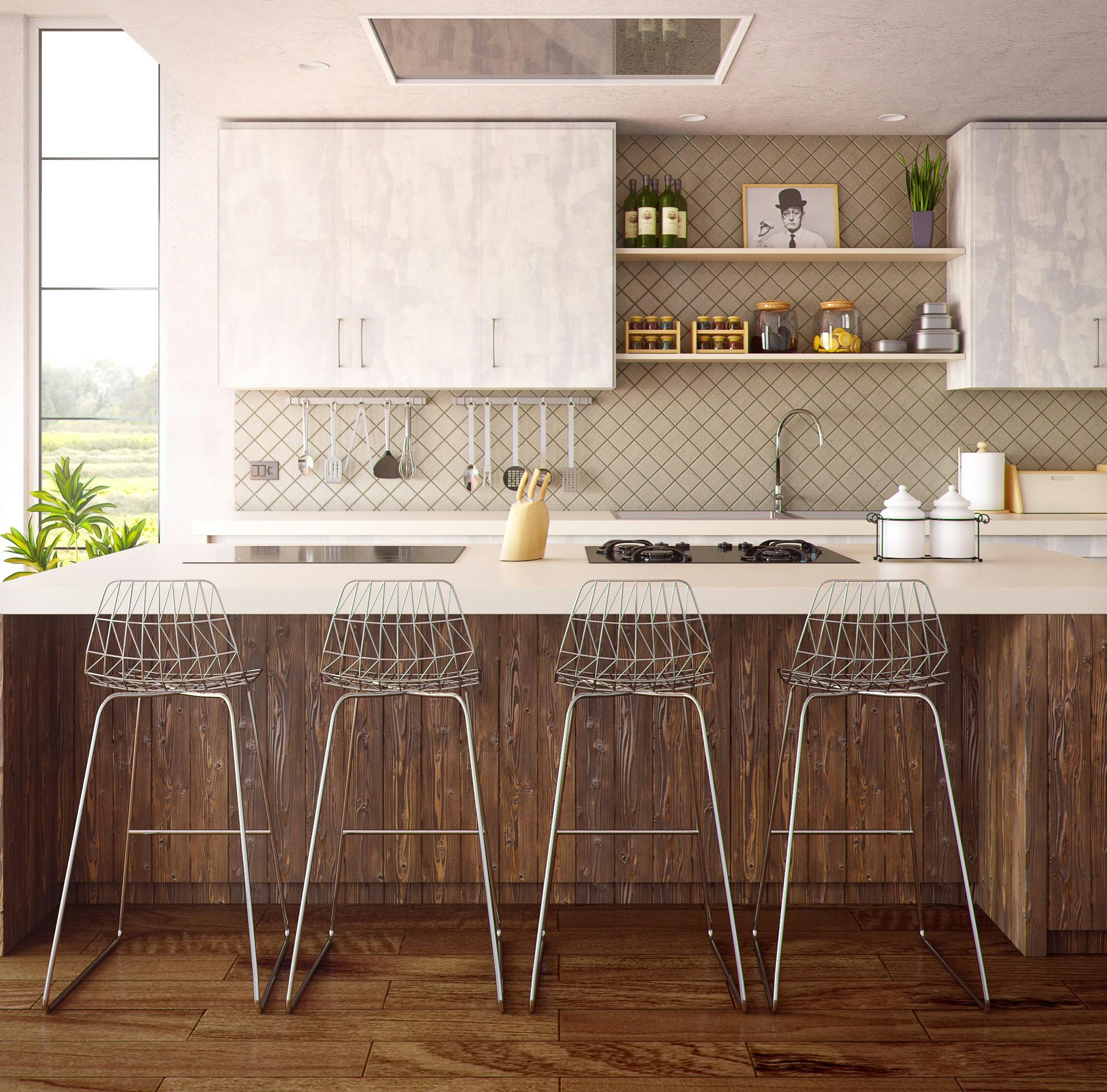 four grey bar stools in front of kitchen countertop